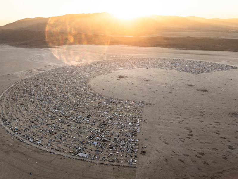 An aerial view of a desert with a circle in the middle