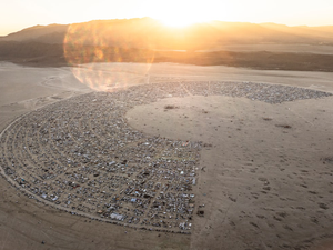 An aerial view of a desert with a circle in the middle