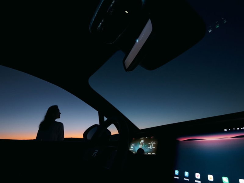 a person sitting in a car at night