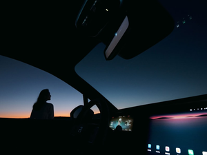 a person sitting in a car at night