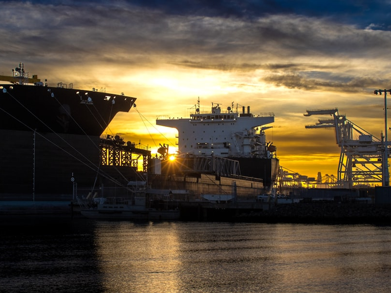 a couple of large ships at a dock