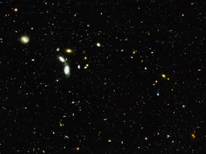 Hubble Goes 'Deep' to Sample Young Galaxies Caption NASA's Hubble Space Telescope reached back to nearly the beginning of time to sample thousands of infant galaxies. Credits NASA, ESA, the GOODS Team and M. Giavalisco (STScI)