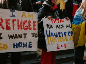 a group of people holding signs in protest