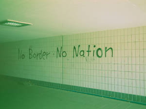 Urban street art graffiti quote: NO BORDER • NO NATION - political protest. Made with Leica R7 (Year: 1994) and Leica Summilux-R 1.4 50mm (Year: 1983). Homemade analog scan. Film reel: Fujicolor Velvia 50 (expired 2005)