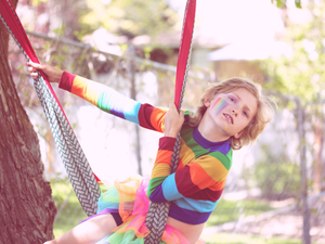 Bink, a gender non-conforming 10 year old child playing outside. 
