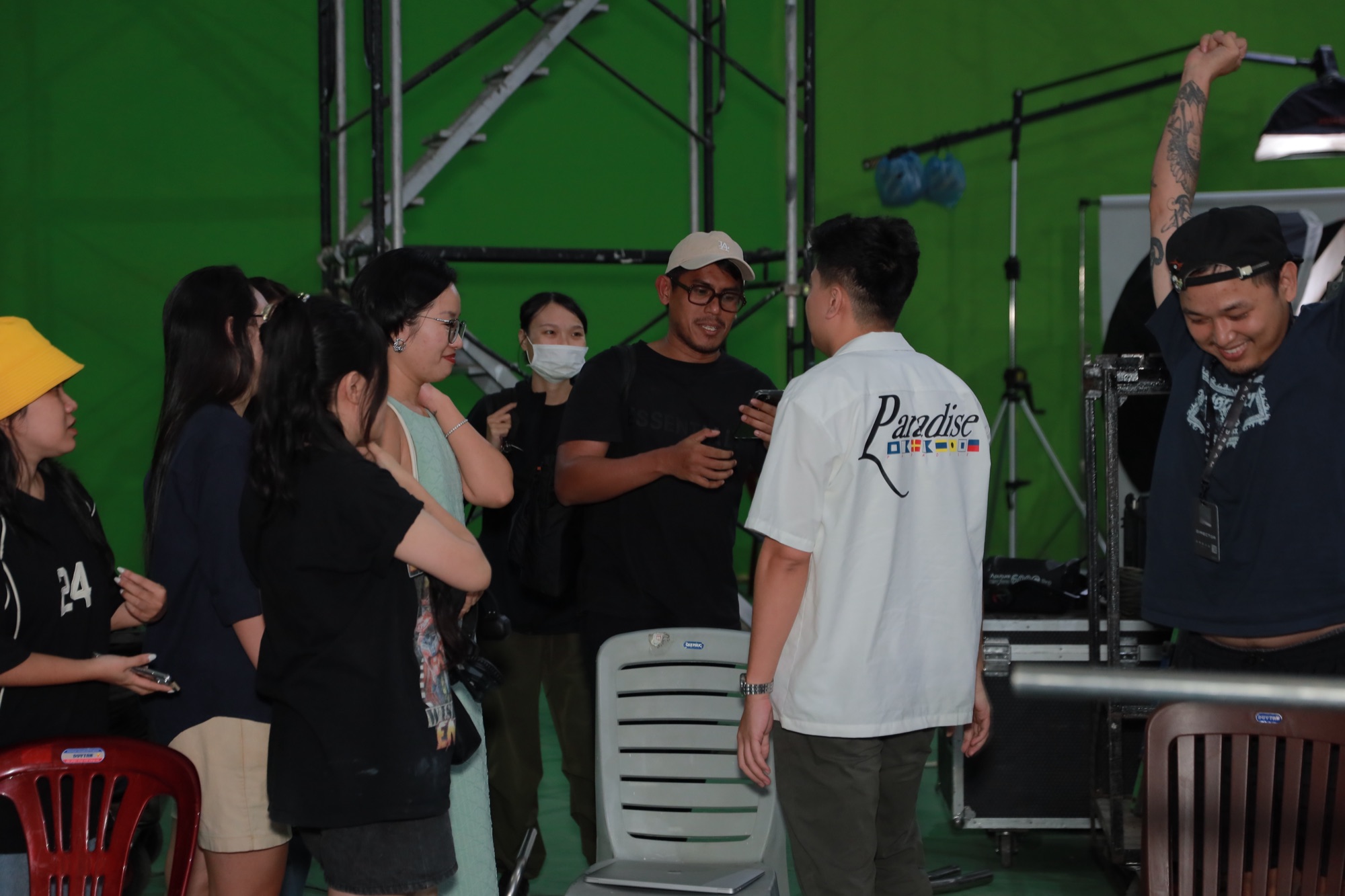 Crew celebrating the end of a day in a green-screen studio during a Samsung Galaxy A16 shoot