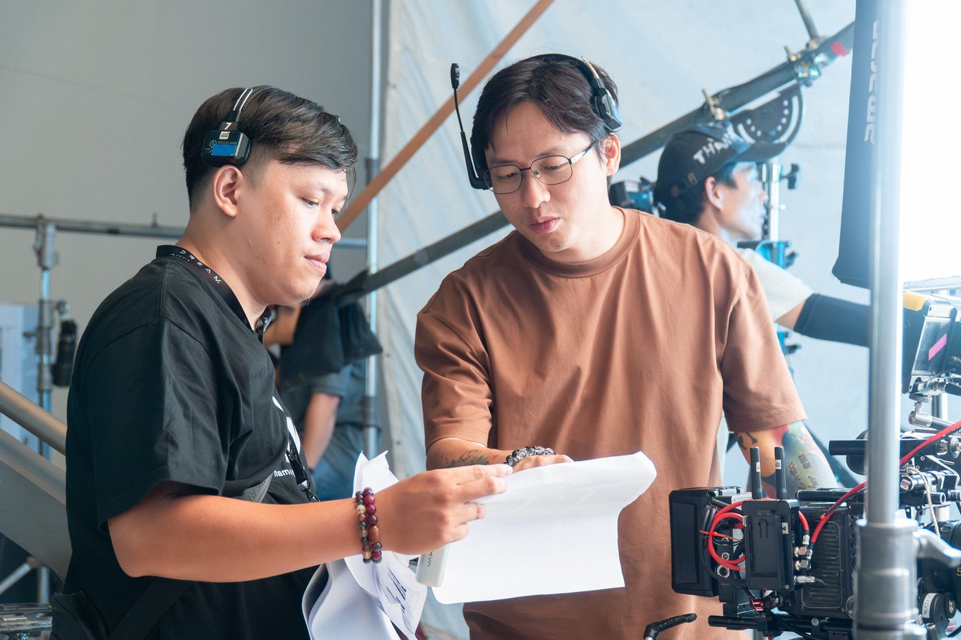 Director and director of photography going through the shot list beside the camera on a Vaseline shoot