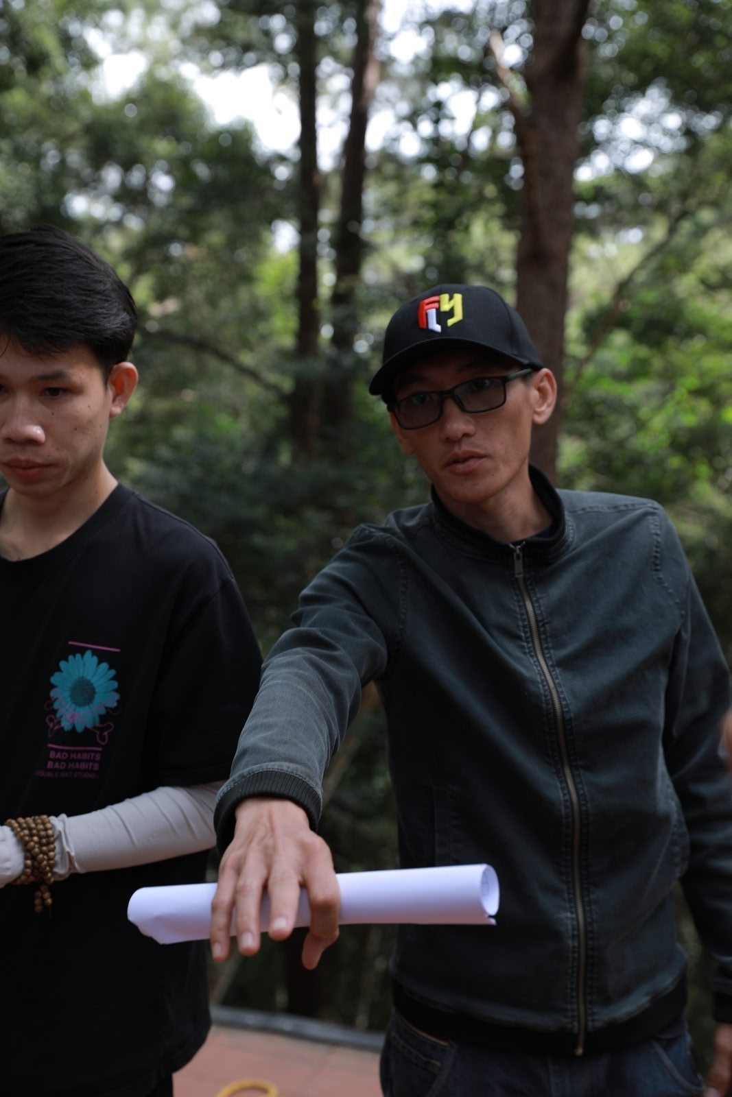 Đà Lạt, script rolled up, on the trail