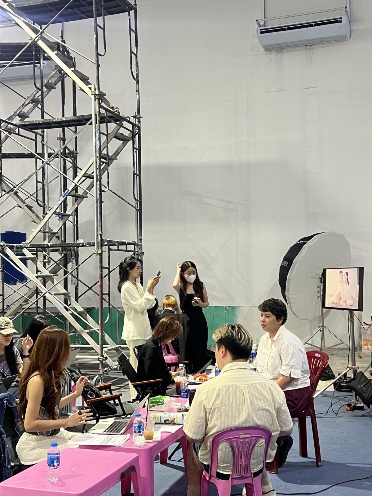 Enat, pink stools, busy table
