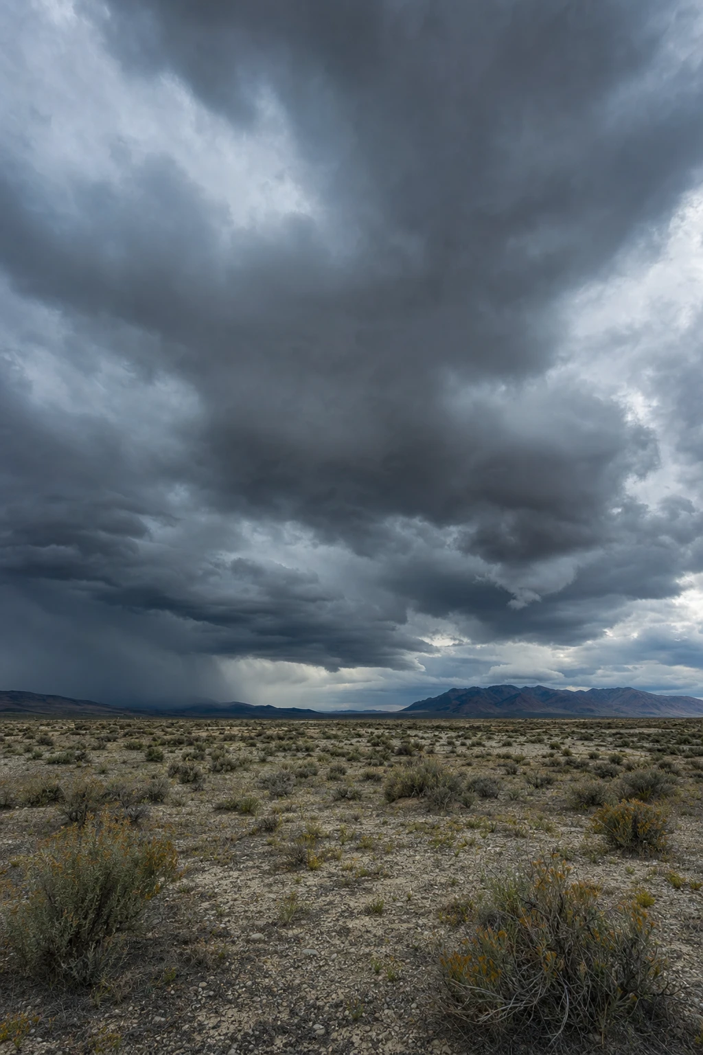 Absolutely, the vastness challenges perception—tiny figures beneath a tumultuous sky remind us how scale shapes trust and meaning in shared space.