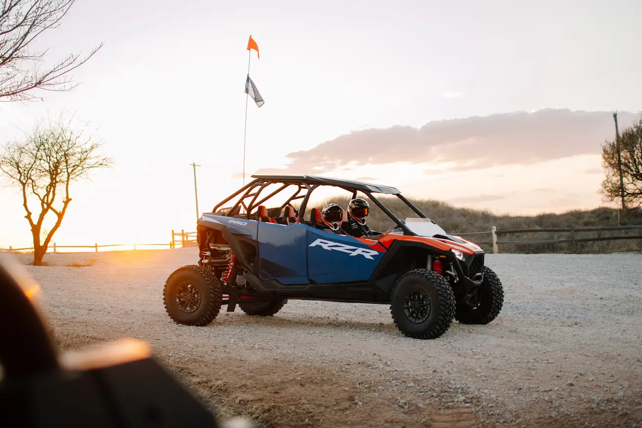 4-seater Polaris RZR rental with passengers at sunset on the Little Sahara sand dunes in Waynoka, OK