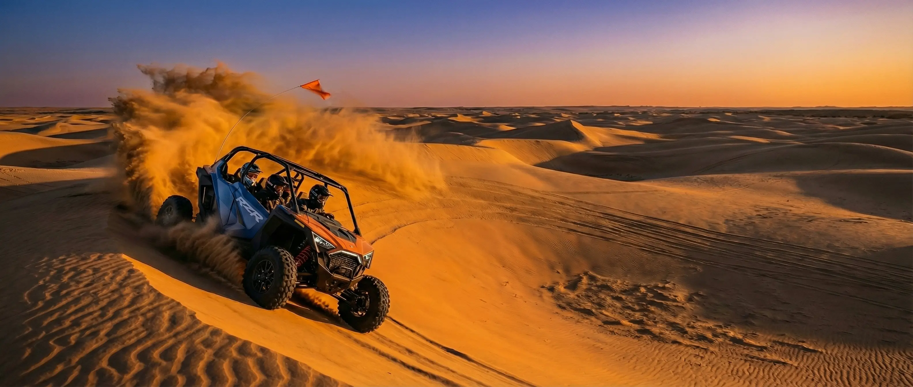 Side-by-side on a sand dune in waynoka - little sahara at sunset