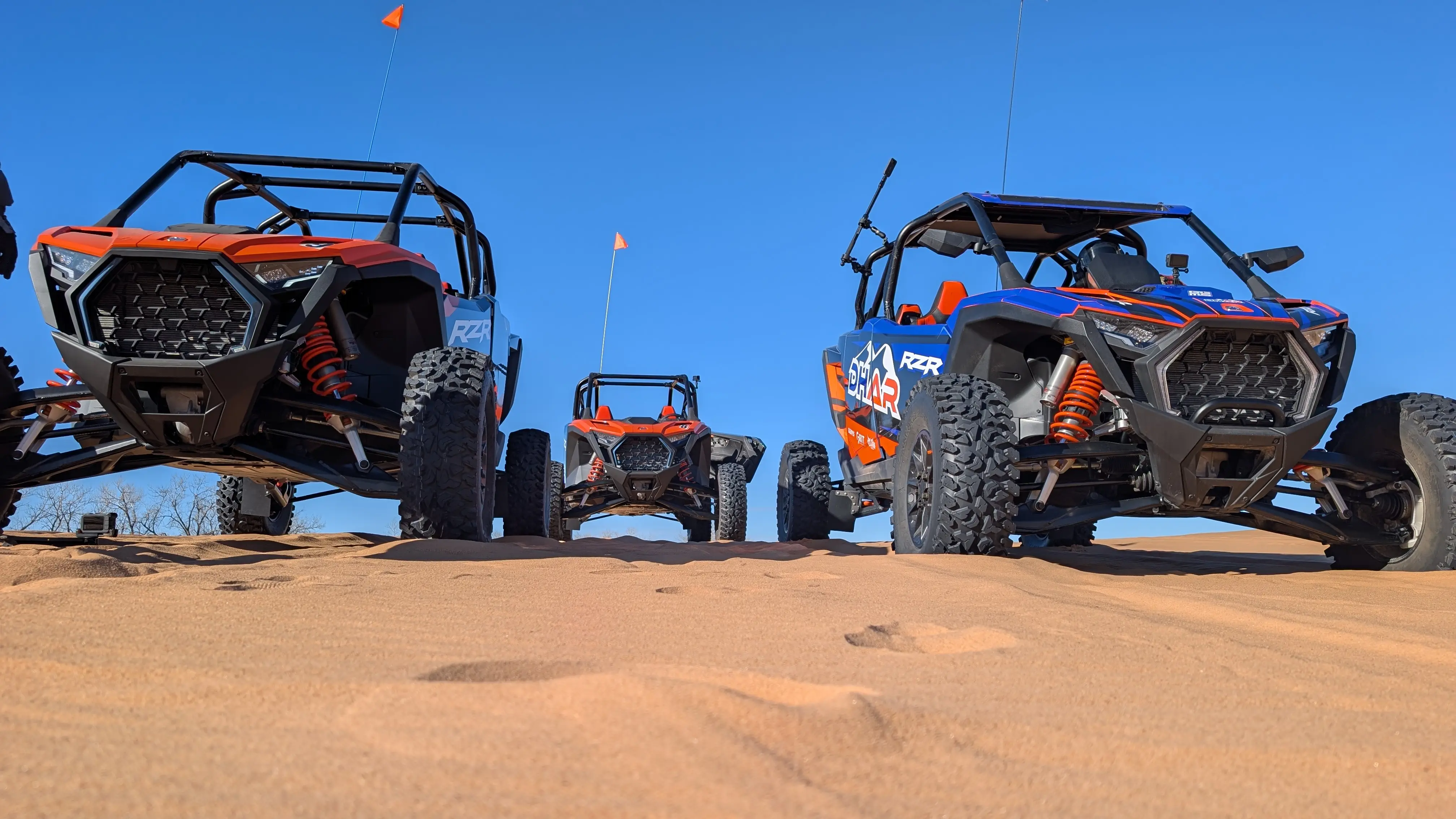 Fleet of Polaris RZR Turbo and Pro R UTVs on the sand dunes at Little Sahara State Park—the ultimate ATV rental alternative near Oklahoma City.