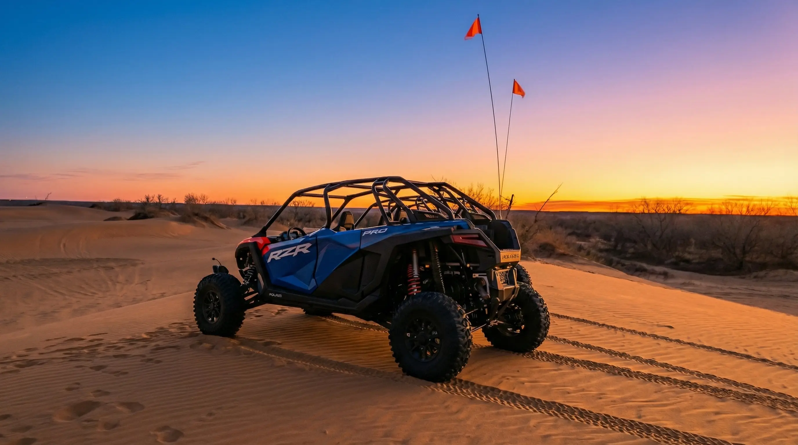Golden hour sunset view of a Polaris RZR at Little Sahara State Park, featured in a customer review.