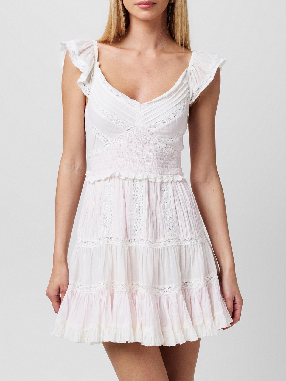 Soft white/pink ruffled dress with detailing