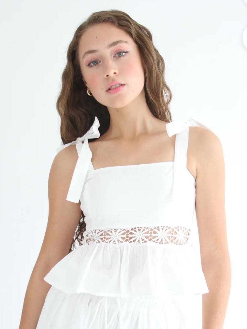 Seven eyelet white top