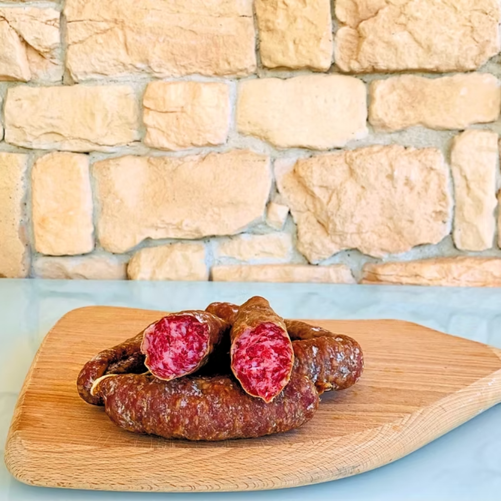 Cesto di Natale "Norcino" - 7 Pezzi (Salamella di Suino Nero, Guanciale Stagionato, Pancetta Tesa di Suino Stagionata, Salamini Stagionati al Tartufo Nero, Salamini Stagionati al Pepe, Salsiccette Stagionate al Finocchio, Coppiette Stagionate di Prosciutto)