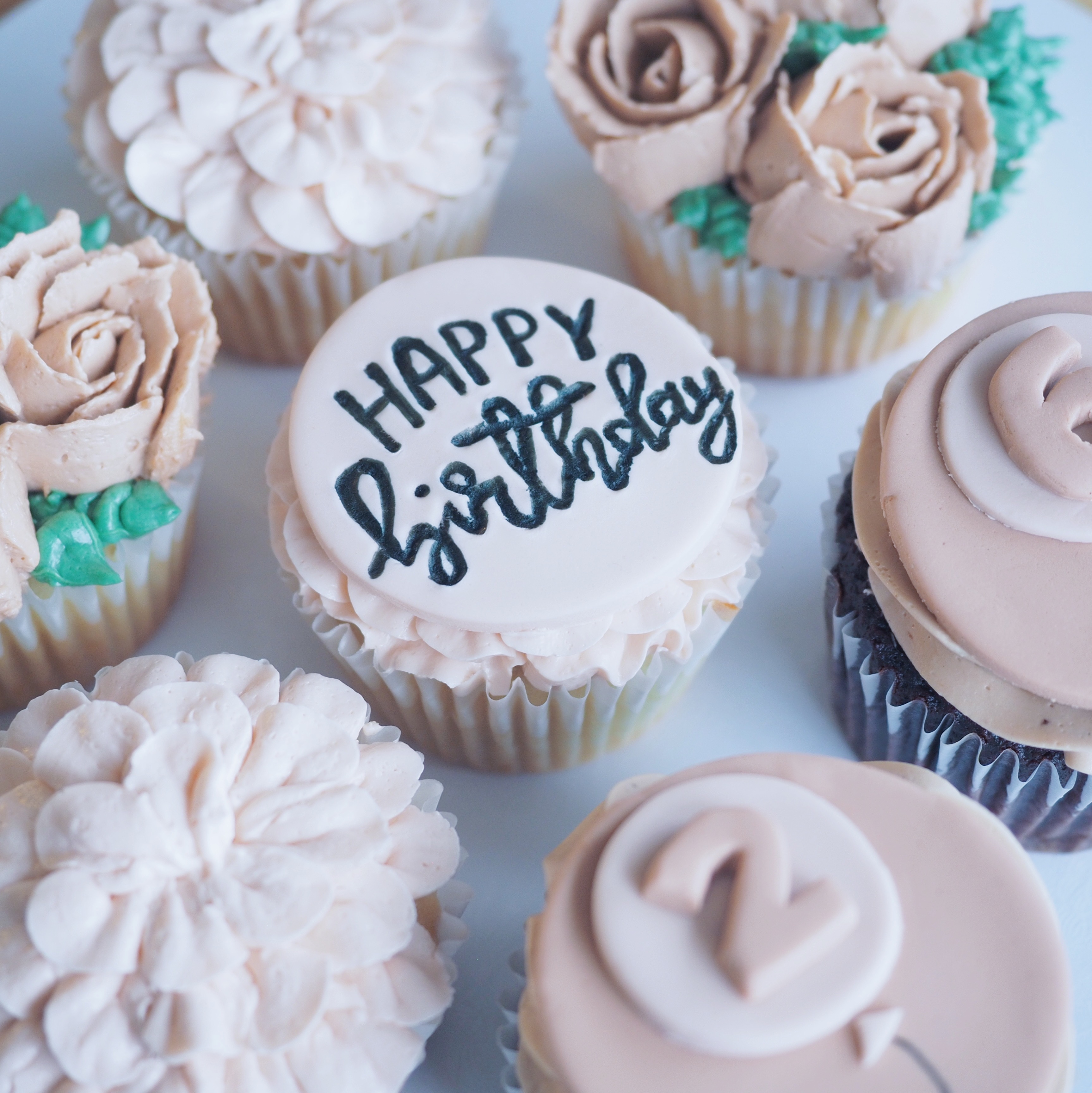 Floral themed cupcake with fondant topper