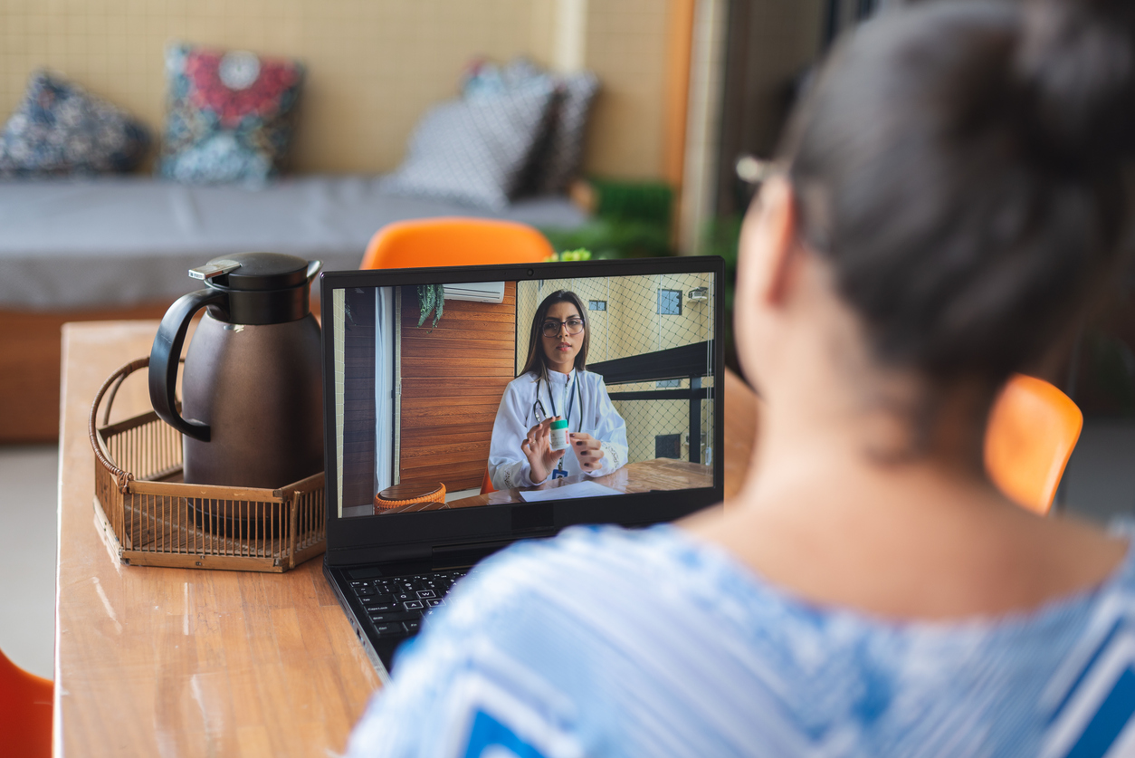 Online doctor consultation on laptop
