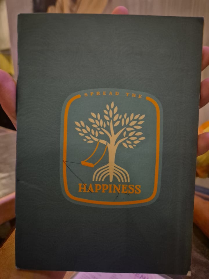 Photograph of the menu at Hapiness Restaurant