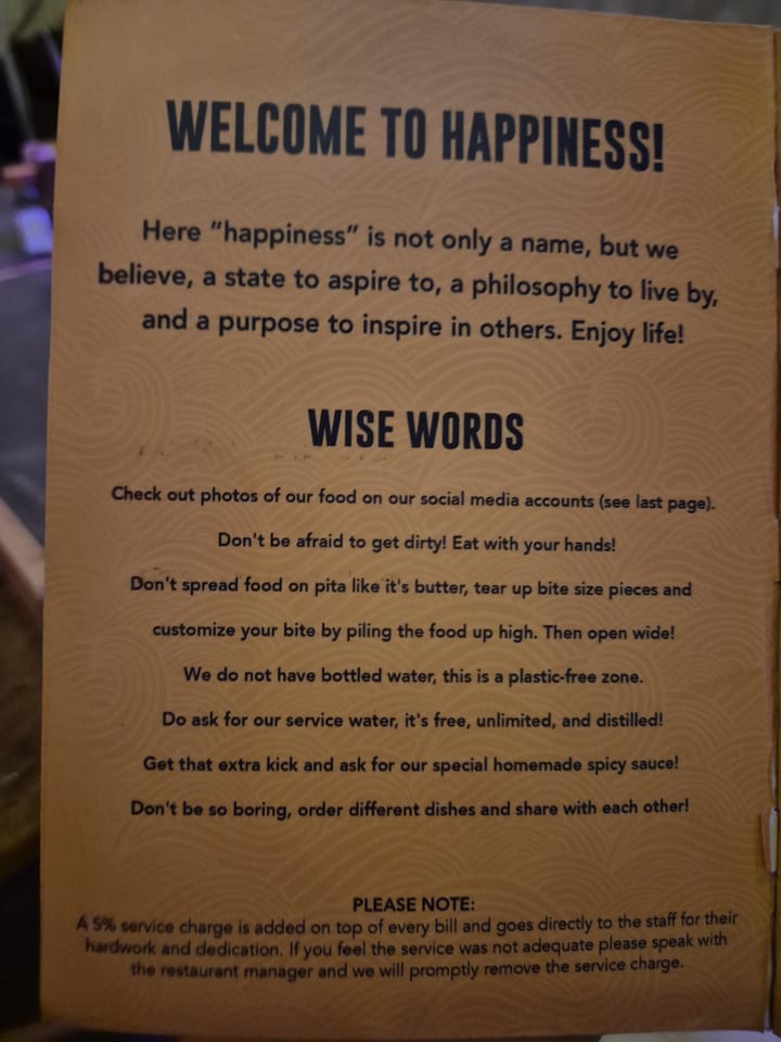 Photograph of the menu at Hapiness Restaurant