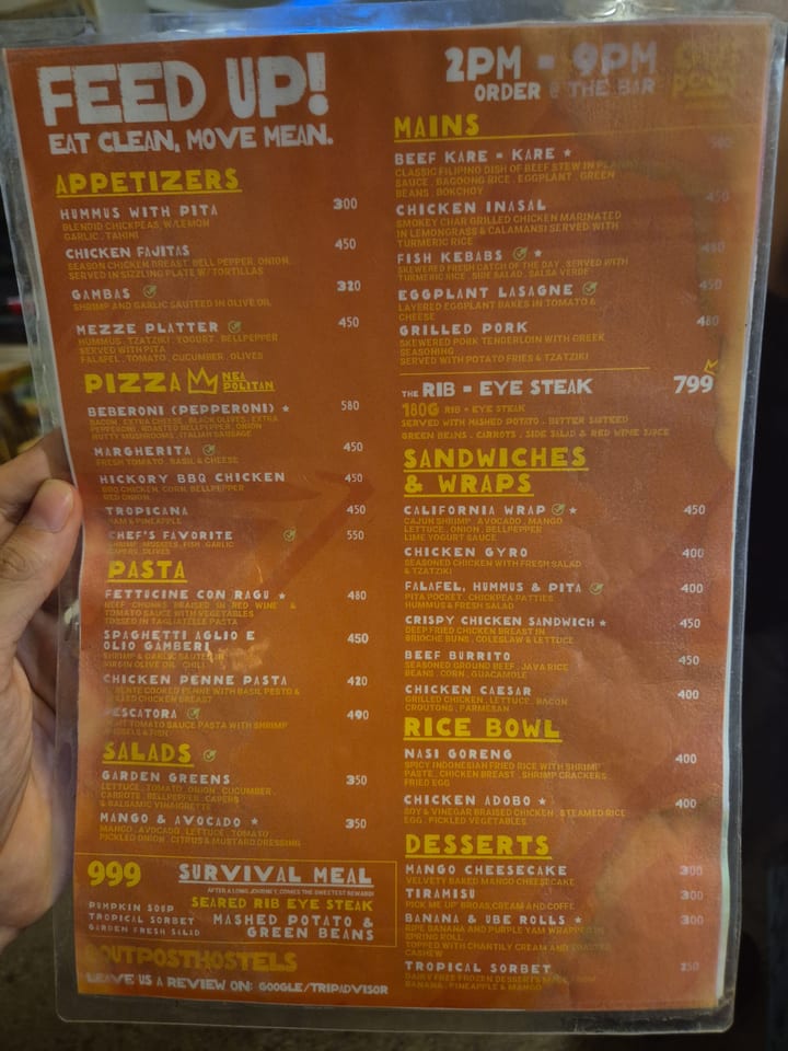 Photograph of the menu at Outpost Beach Hostel