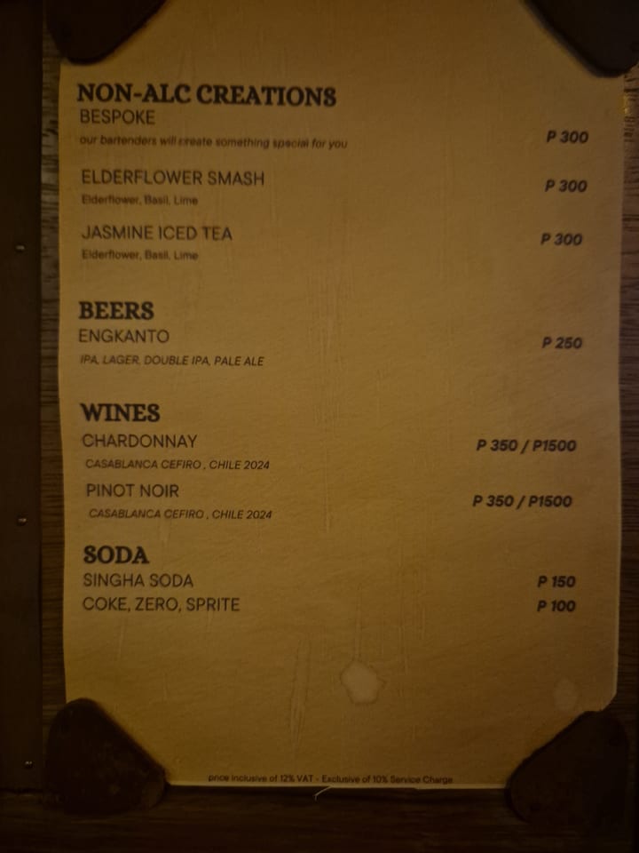 Photograph of the menu at The Pangolin - Cocktail Bar