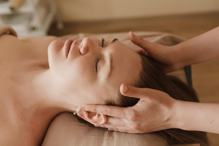 A woman receiving craniosacral therapy