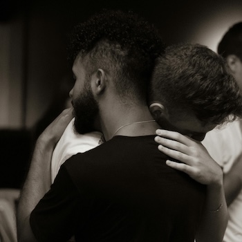two men embracing each other