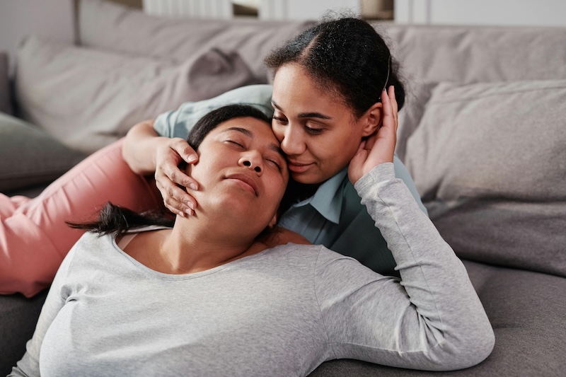 Two women cuddling