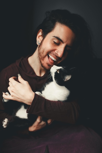 Man huggin a cat