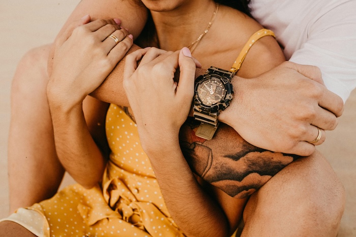 A man hugging a woman
