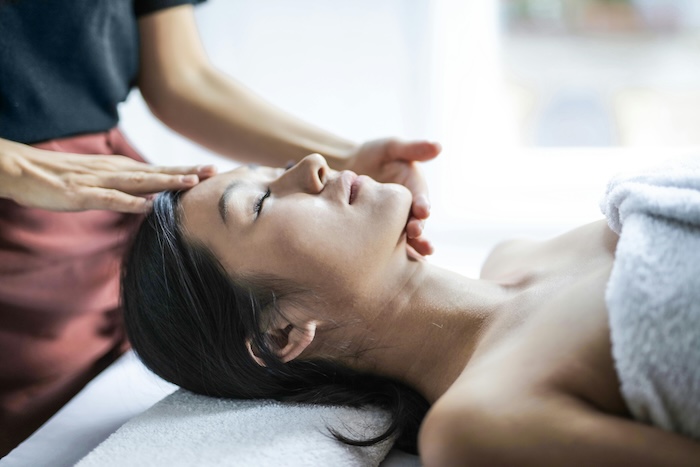 A person receiving craniosacral therapy