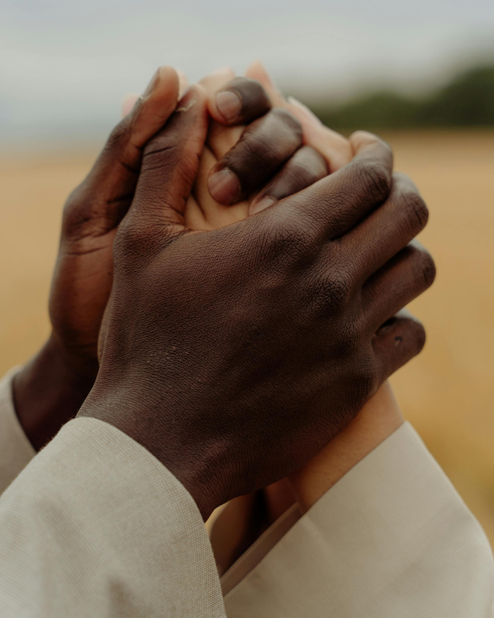 Hands embracing