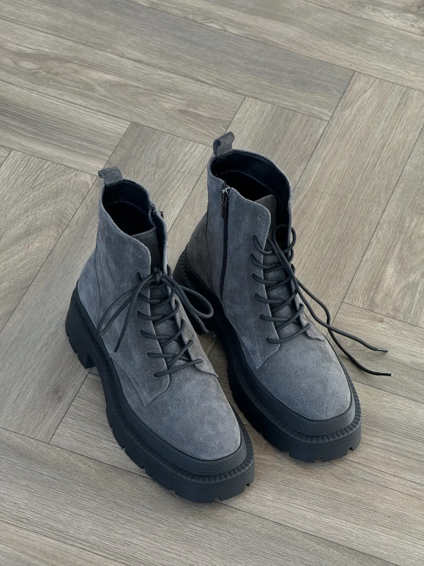 Graphite suede boots on a chunky sole lined with natural fur