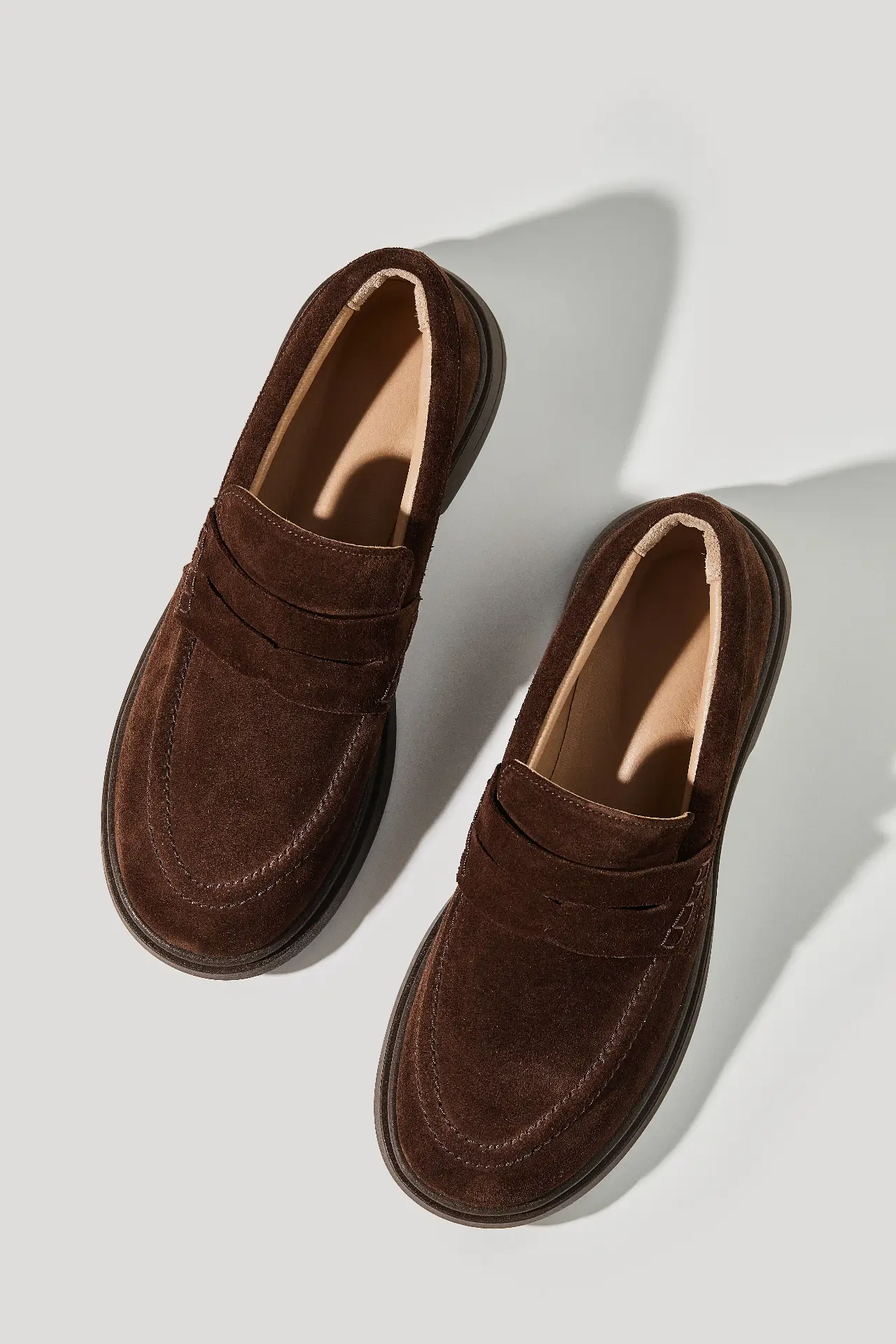 Chocolate suede loafers with a round toe