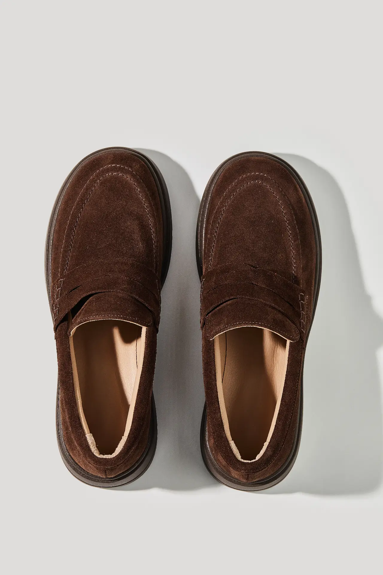 Chocolate suede loafers with a round toe