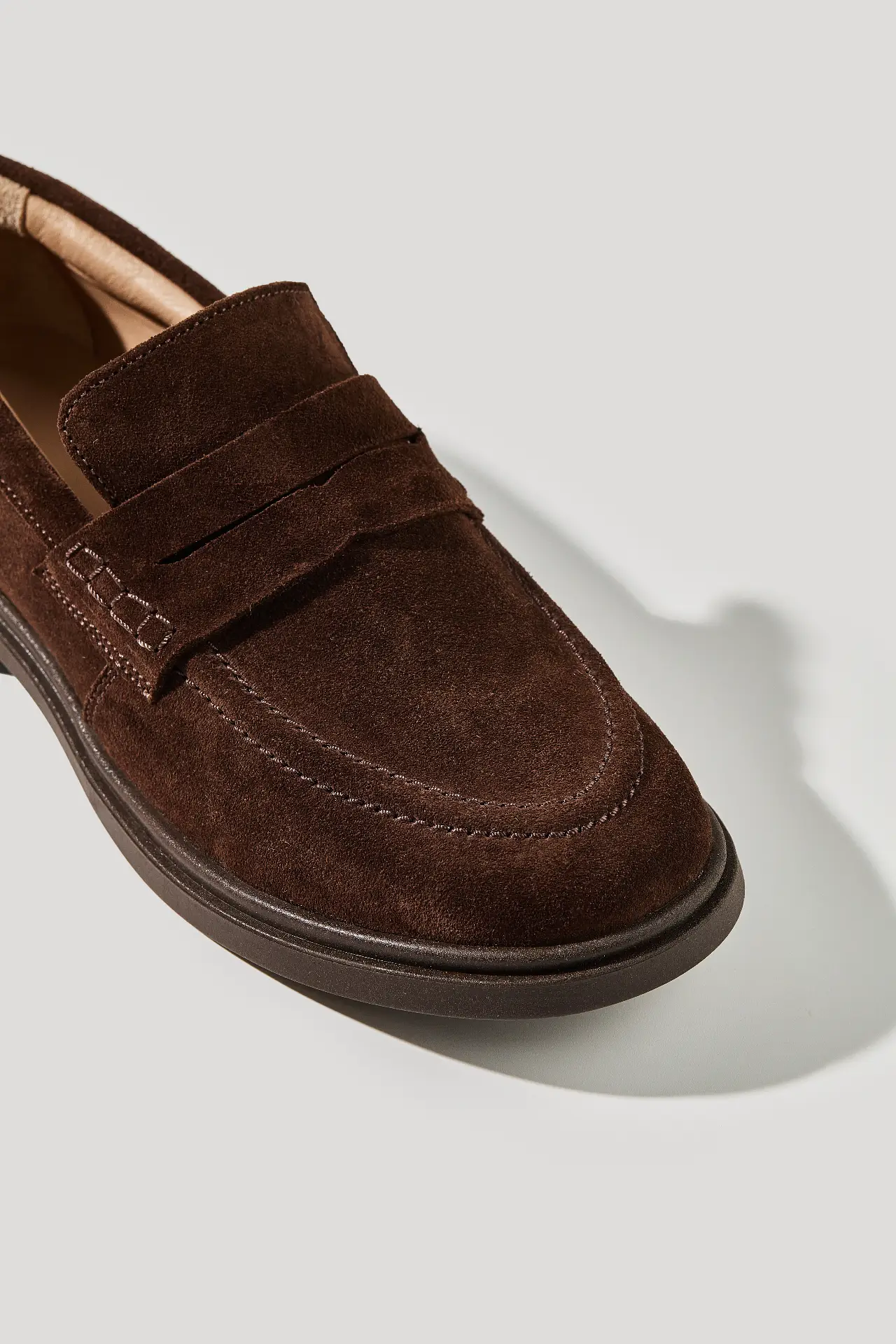 Chocolate suede loafers with a round toe