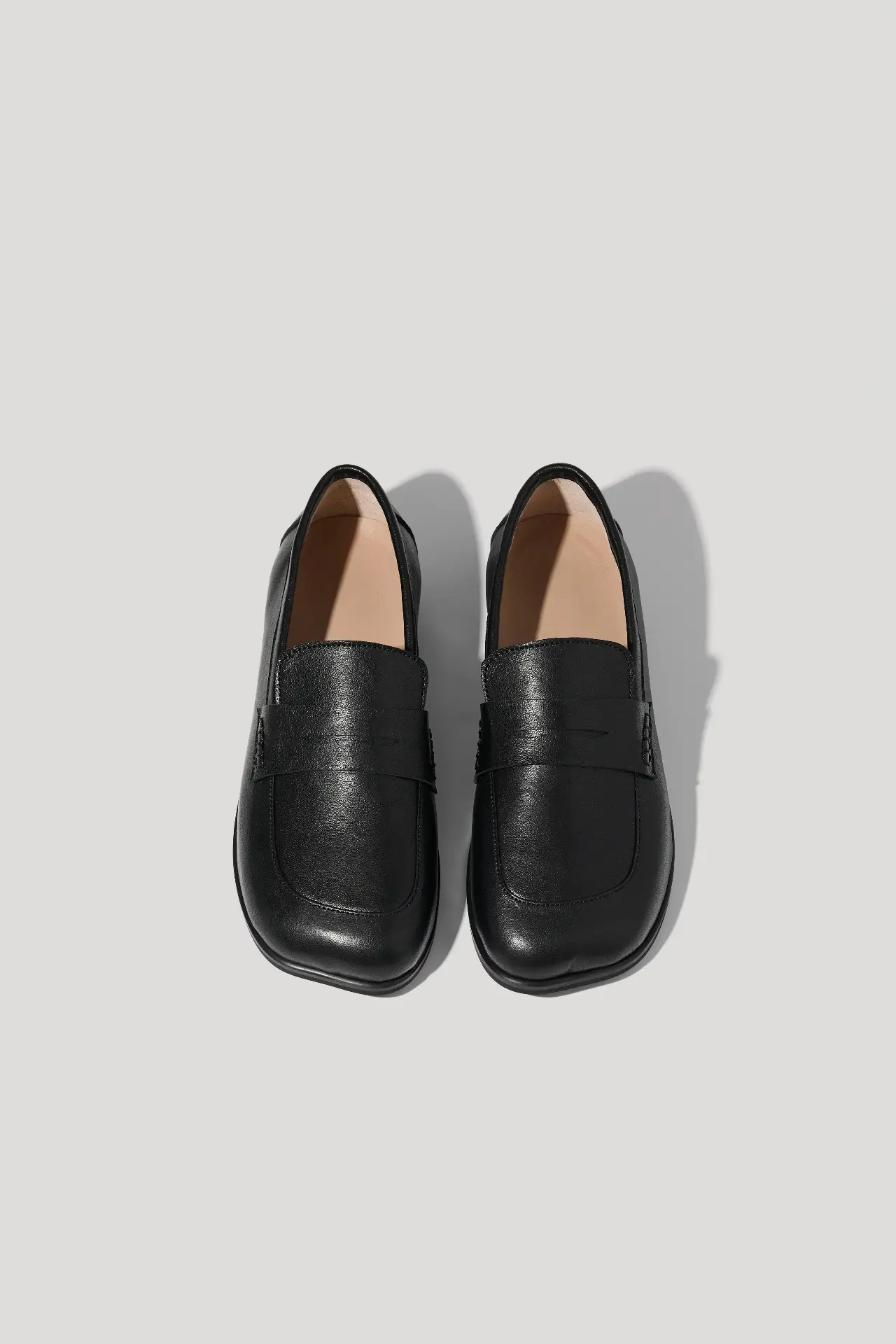 Black leather loafers with an anatomical toe shape