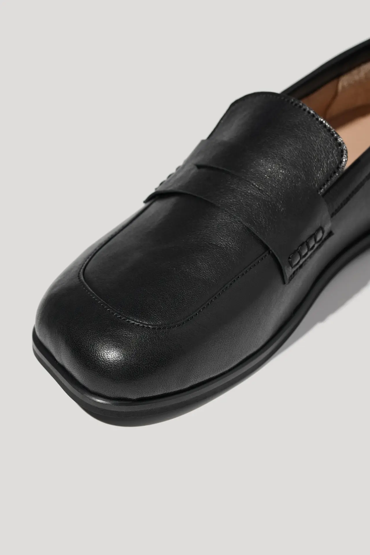 Black leather loafers with an anatomical toe shape