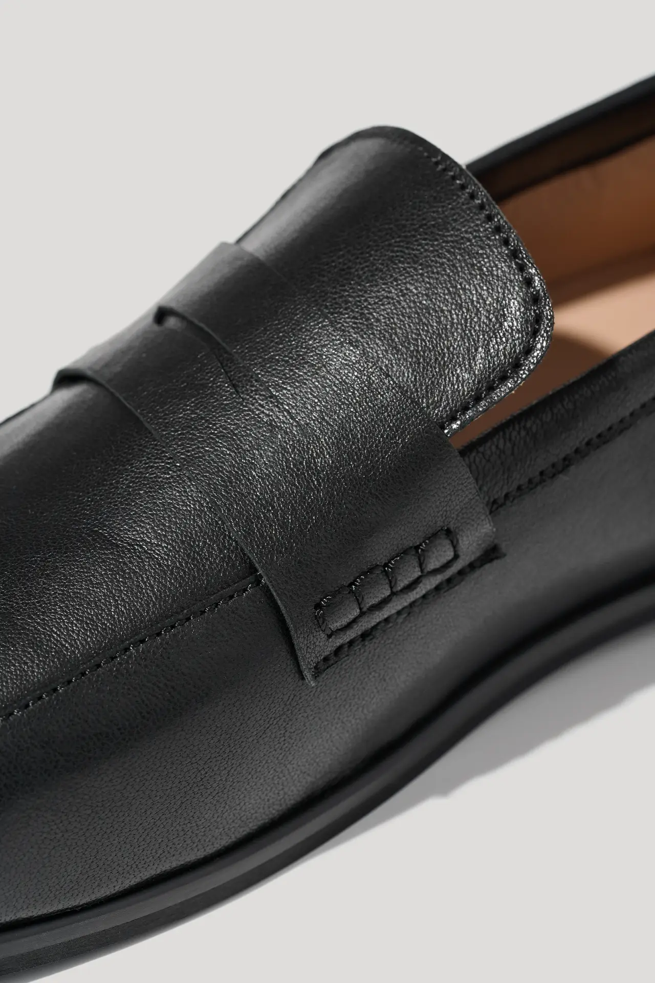 Black leather loafers with an anatomical toe shape