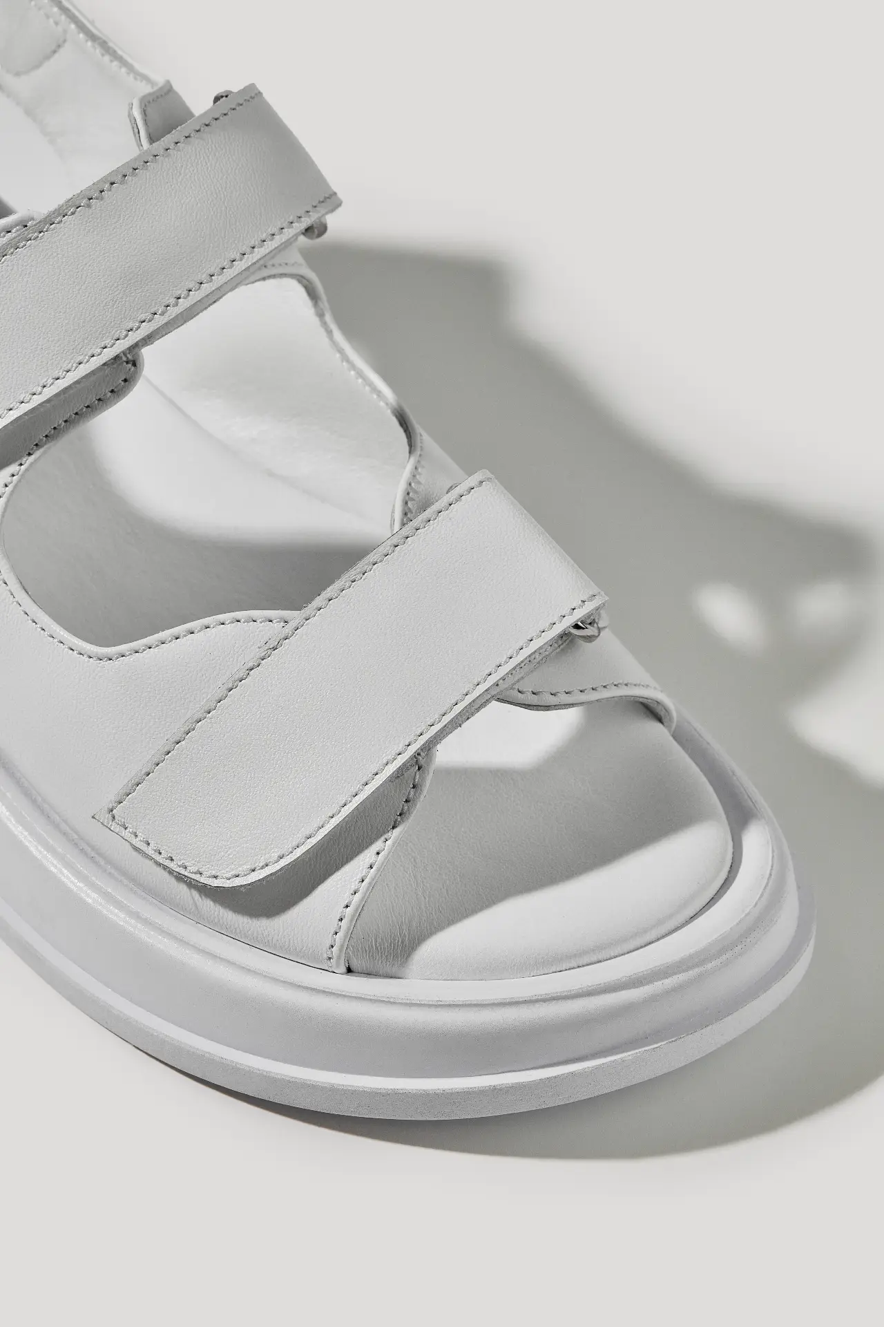 White leather sandals with hook-and-loop straps