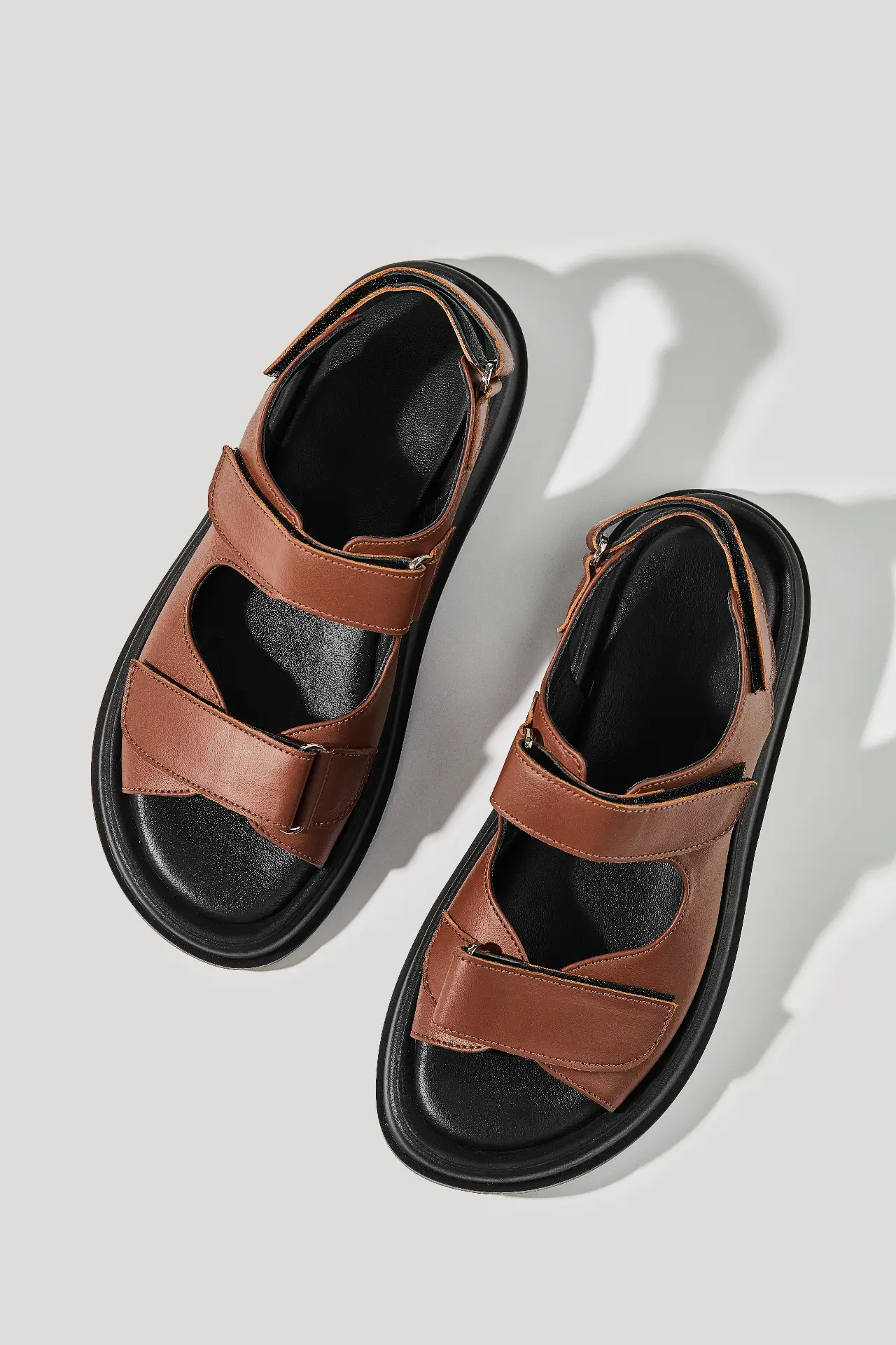 Brown leather sandals with hook-and-loop straps