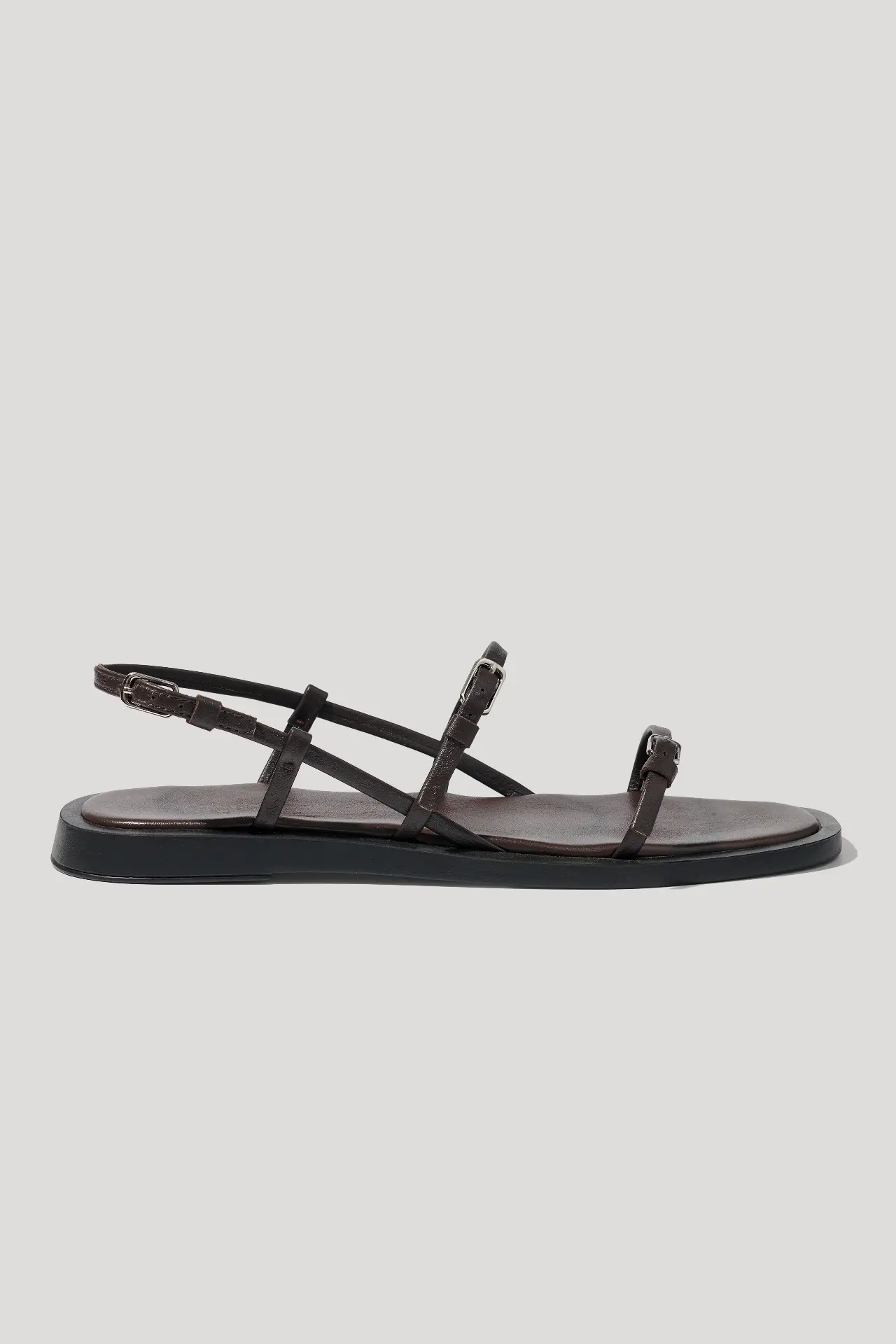 Minimalist black leather sandals with slim straps
