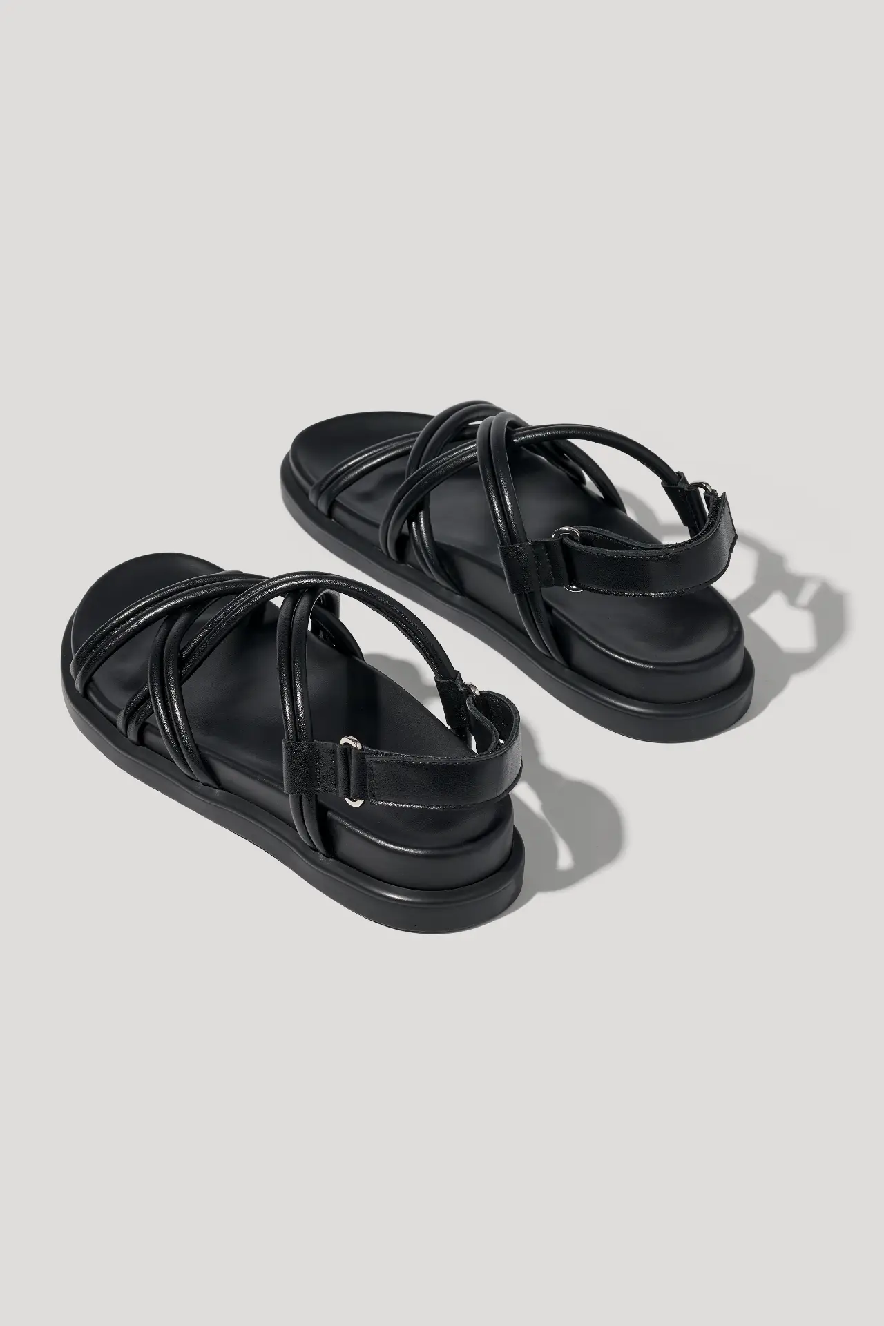 Black leather sandals with cross‑straps