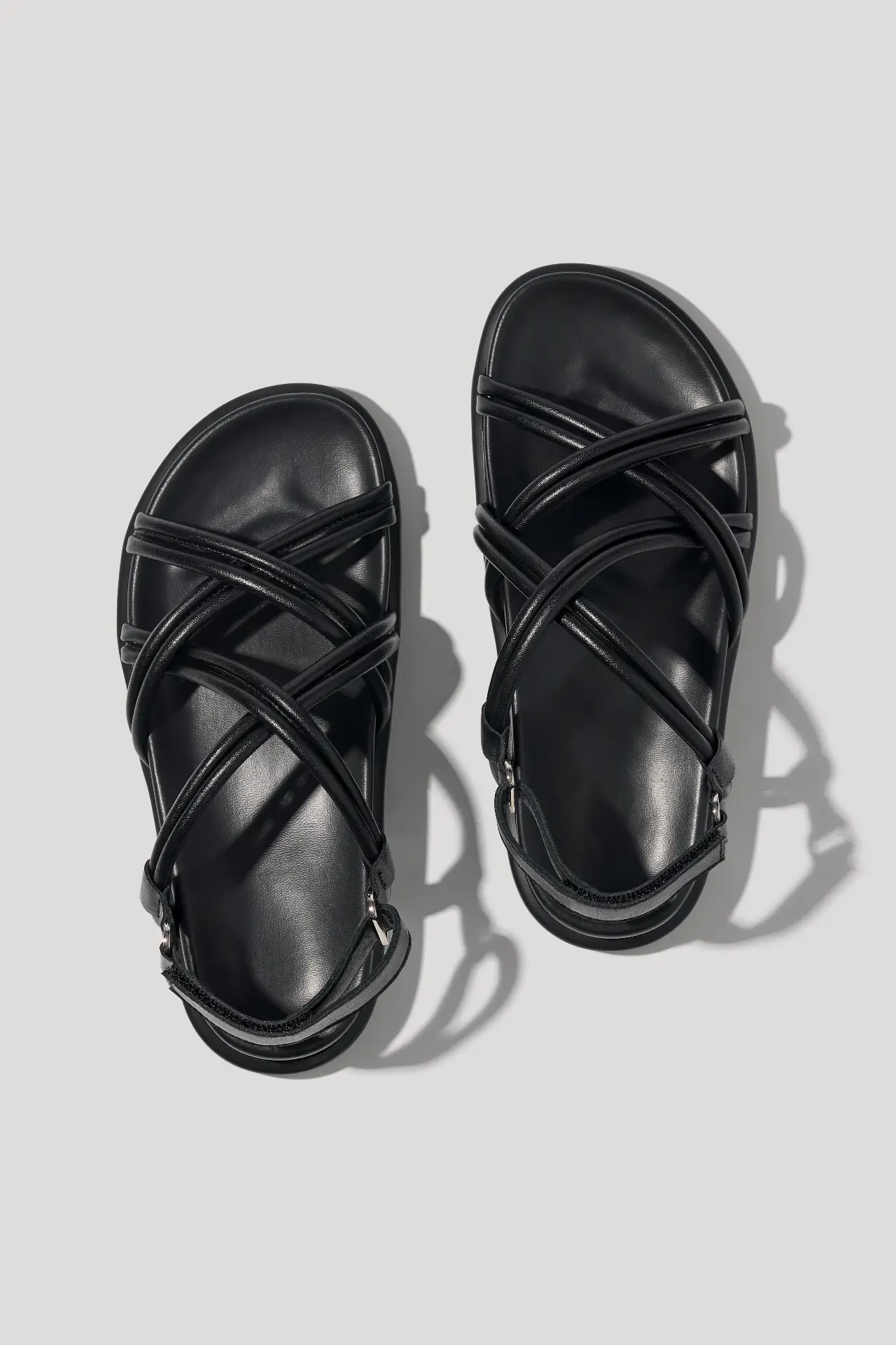 Black leather sandals with cross‑straps