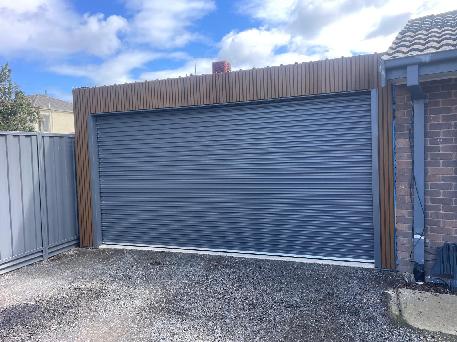 Fixing the tracks on a garage roller door.