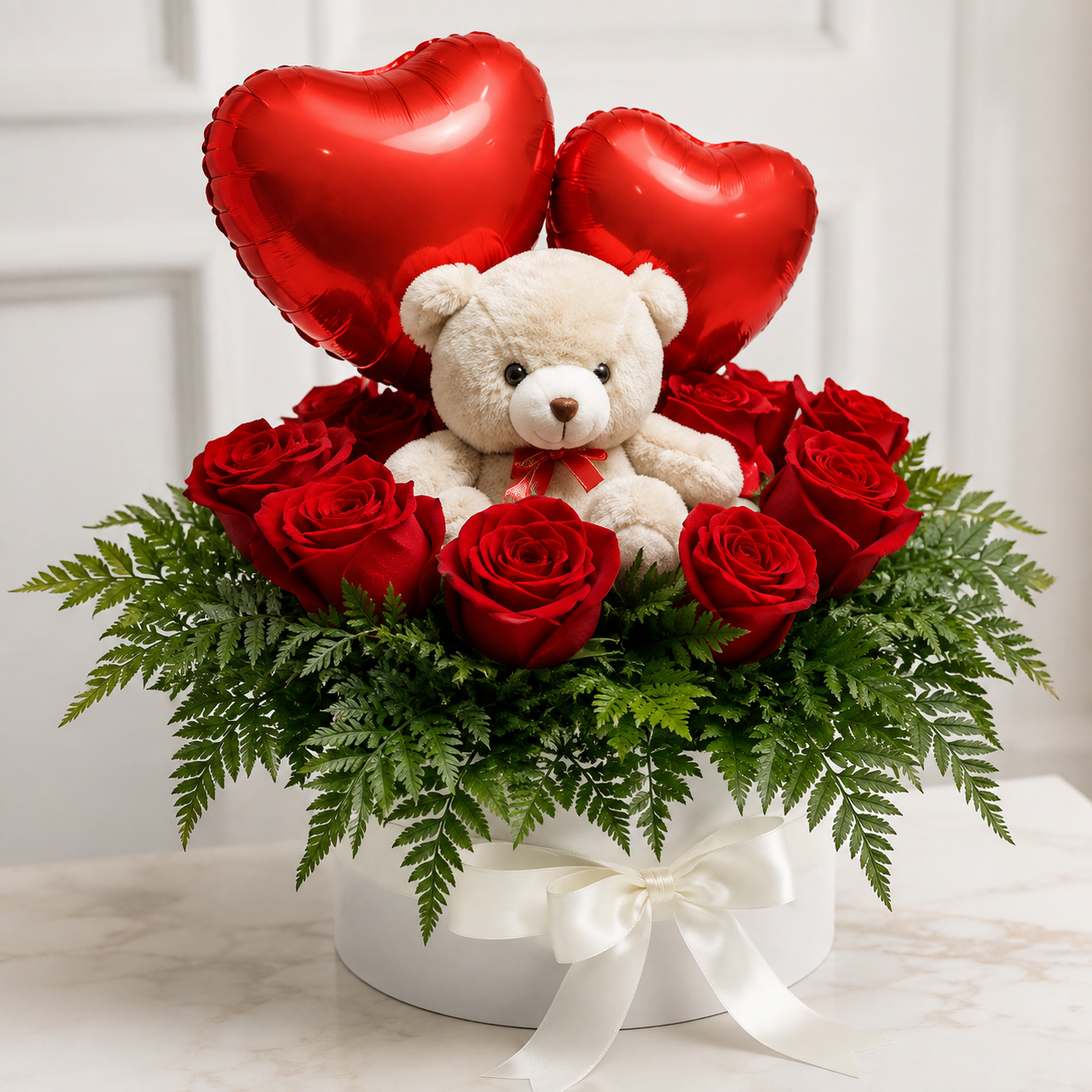 Caja 12 rosas con oso de peluche y globos 