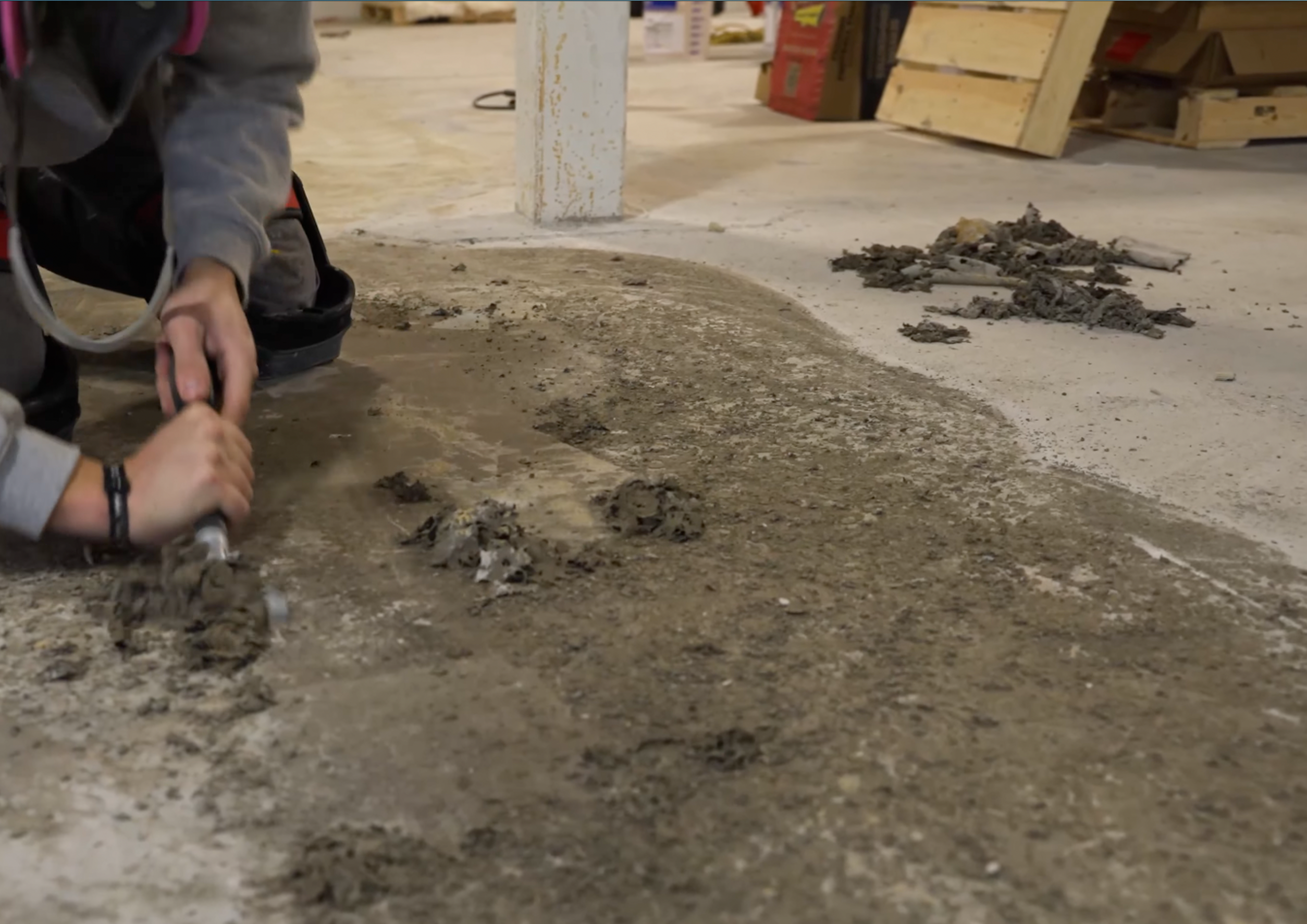 Cracked Warehouse Floor With Chemical Stains And Heavy Wear From Loads