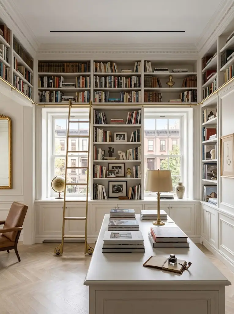 Floor-to-ceiling library with rolling ladder — Era Interiors